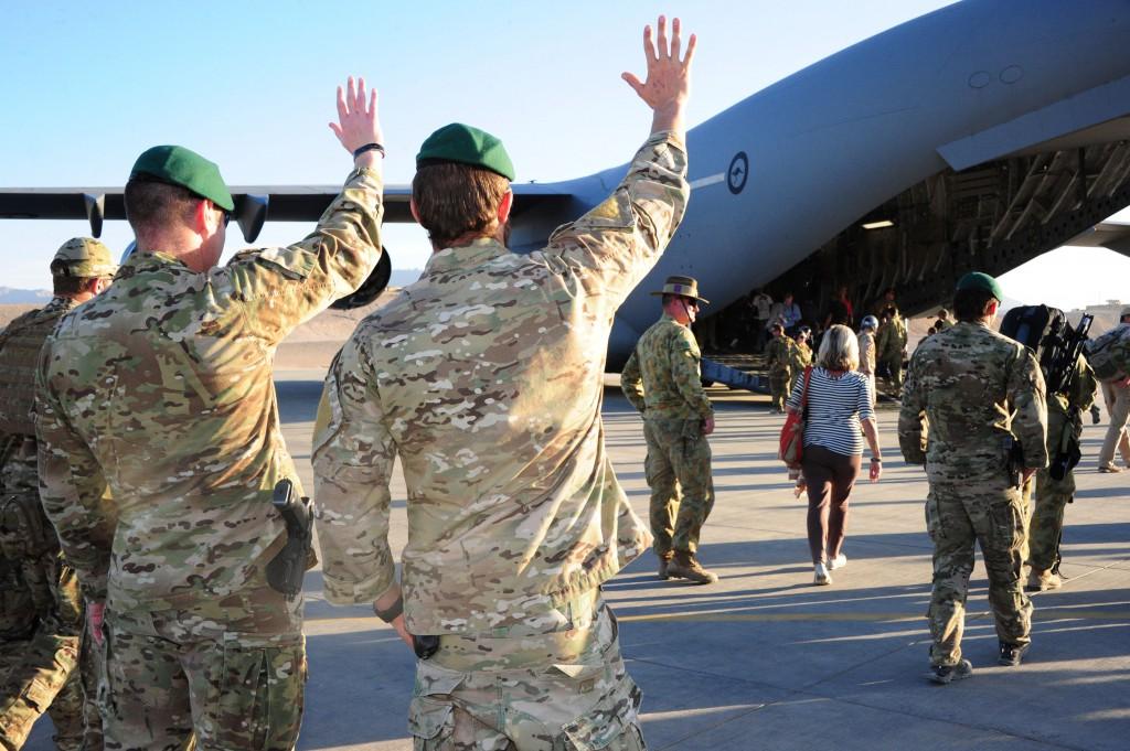 Australian Army soldiers from the Special Operations Task Group wave goodbye to the families of Australia's fallen after a ceremony at Multi National Base – Tarin Kot, southern Afghanistan.