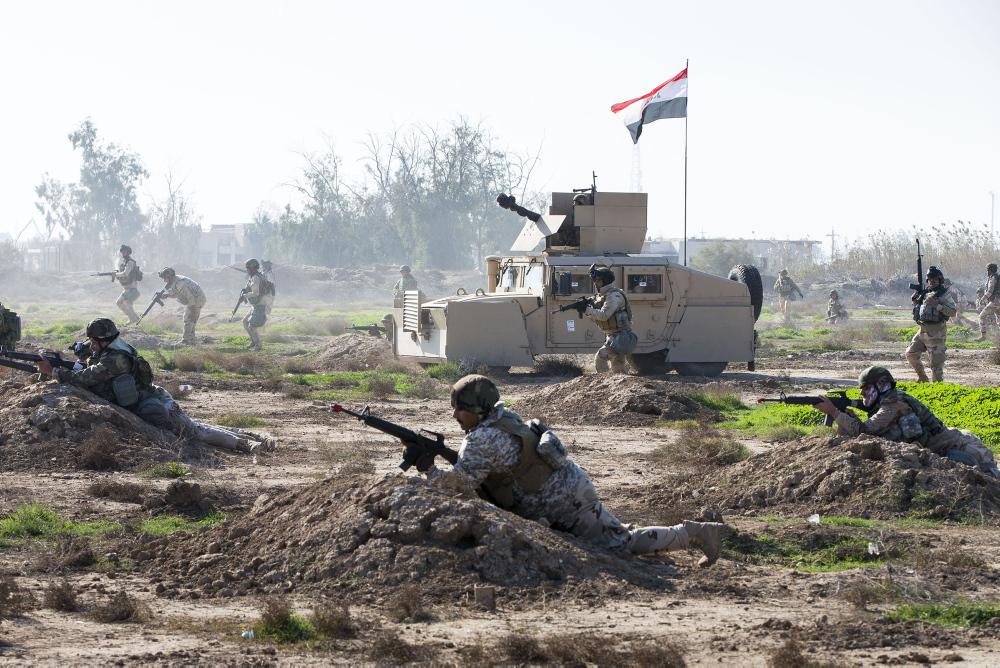 Iraqi Army soldiers assault forward during a battalion clearance training scenario at the Taji Military Complex, Iraq. Australian and New Zealand forces are assisting the Iraqi Army to enhance the ability of Iraqi soldiers to combat Daesh. *** Local Caption *** The Iraqi Army's 1st Battalion from the 71st Brigade has conducted a large culminating activity at the end of their initial training package run by Australian and New Zealand Army trainers from Task Group Taji 2. The 1st Battalion used mortar support, armoured vehicles, engineer capabilities and urban fighting skills to clear a large open area before assaulting into an urban village. 71st Brigade will now move onto an advanced training package. The Iraqi Security Forces continue to be trained by Task Group Taji personnel from Australia and New Zealand at the Taji Military Complex in Iraq as part of the broader international Building Partner Capacity (BPC) mission. The training includes weapon handling, building clearances and obstacle breaching techniques; as well as training in the Tactics, Techniques and Procedures for squad through to company-level operations to use in their fight against Daesh. Task Group Tajis BPC contribution is part of Australias broader Defence contribution to Iraq, codenamed Operation OKRA, which includes a Special Operations Task Group and an Air Task Group.