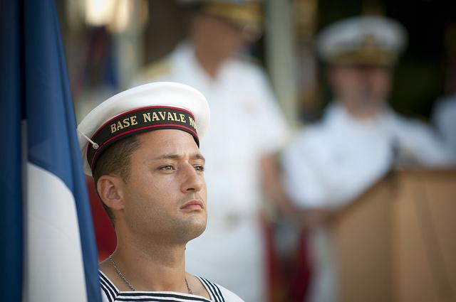 110704-N-CZ945-520 NOUMEA, New Caledonia (July 4, 2011) A sailor of the French navy holds the flag of France for a wreath laying ceremony in commemoration of the Fourth of July and in memory of the American presence in New Caledonia during World War II. U.S. 7th Fleet command ship USS Blue Ridge (LCC 19) and embarked staff are underway on patrol in the 7th Fleet area of responsibility, and are in New Caledonia for a port visit. (U.S. Navy photo by Mass Communication Specialist 2nd Kenneth R. HendrixReleased)